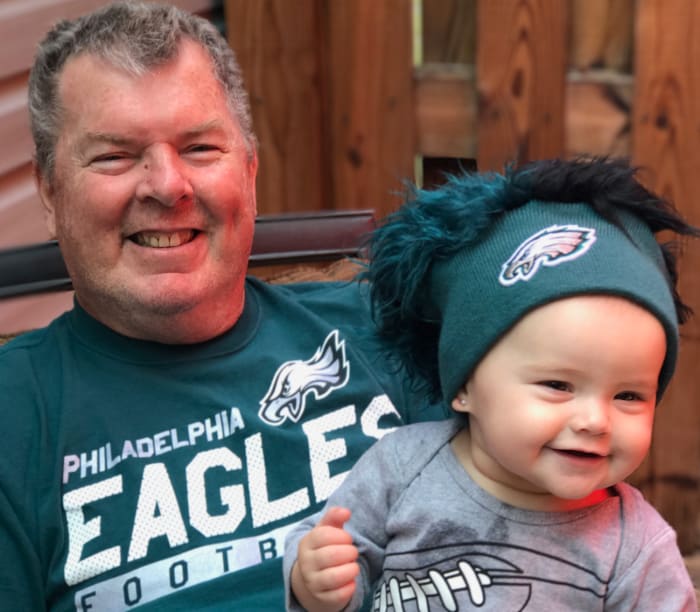 Wayne with granddaughter Henley, a budding Eagles fan.